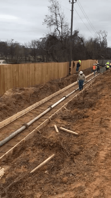 A person walking in a road construction site